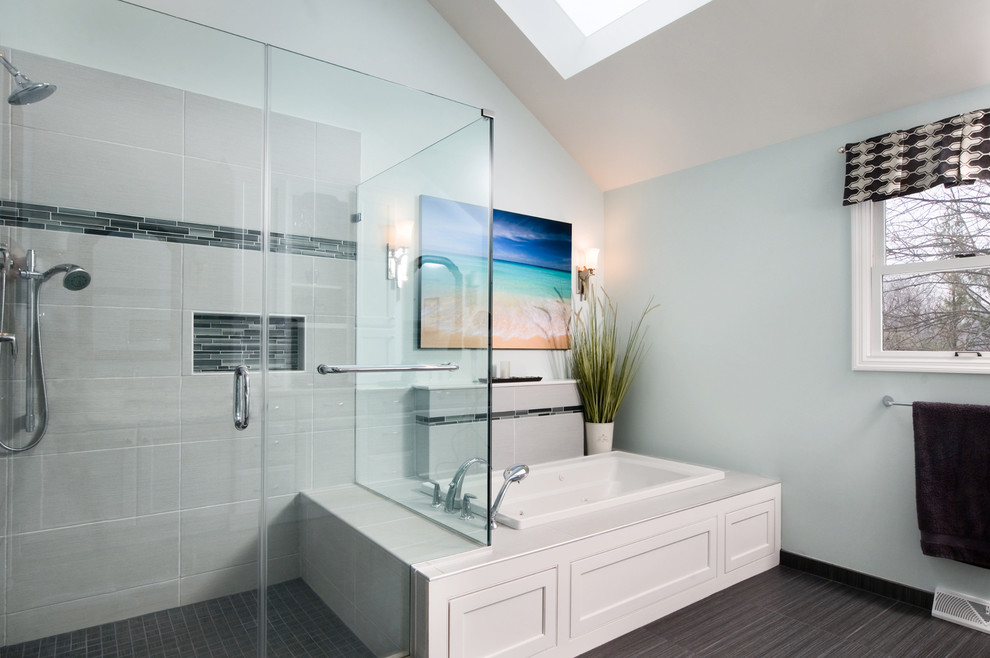 Design ideas for a large transitional master bathroom in Philadelphia with an undermount sink, flat-panel cabinets, white cabinets, engineered quartz benchtops, a hot tub, a corner shower, a two-piece toilet, gray tile, ceramic tile, blue walls and ceramic floors.