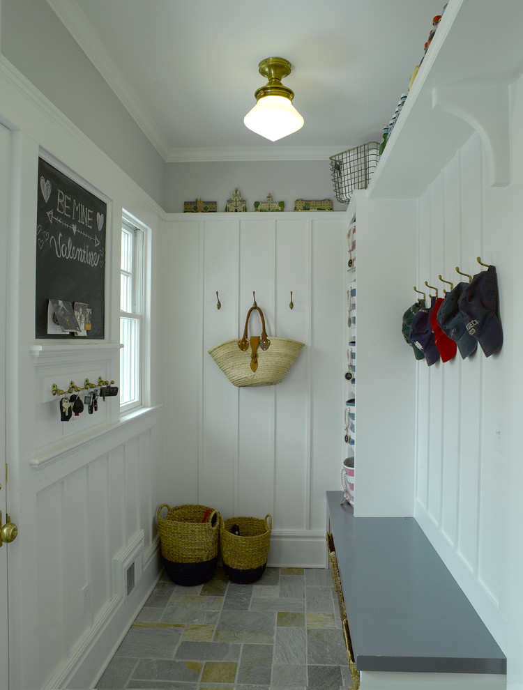 Inspiration for a small transitional mudroom in New York with grey walls, slate floors, a single front door and a blue front door.