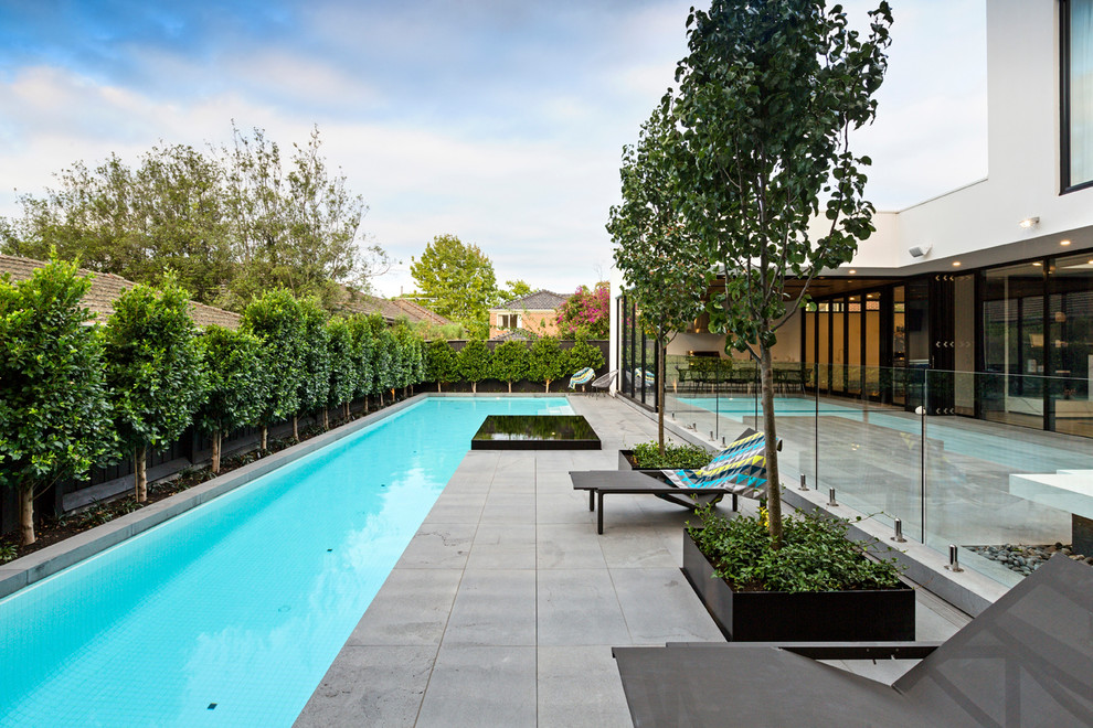 This is an example of a large modern backyard rectangular lap pool in Melbourne.