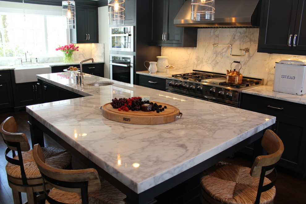 Transitional kitchen photo in New York with marble countertops