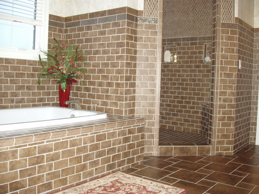 Photo of a traditional bathroom in Chicago with an undermount sink, glass benchtops and ceramic floors.