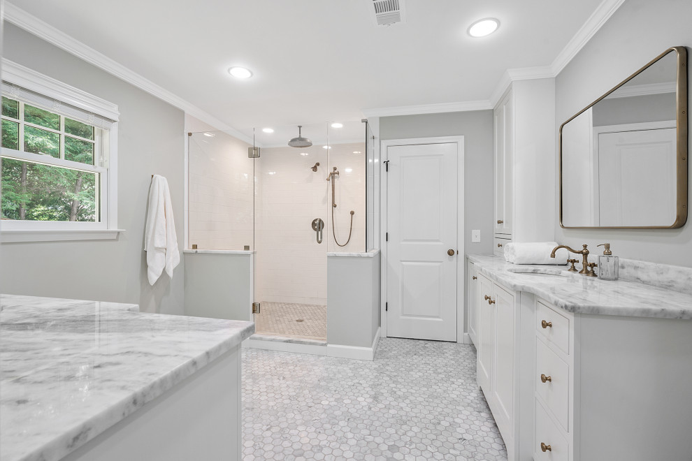 Traditional master bathroom in Atlanta with recessed-panel cabinets, white cabinets, gray tile, marble, grey walls, marble floors, an undermount sink, marble benchtops, white floor, a hinged shower door, grey benchtops, an enclosed toilet, a double vanity and a freestanding vanity.