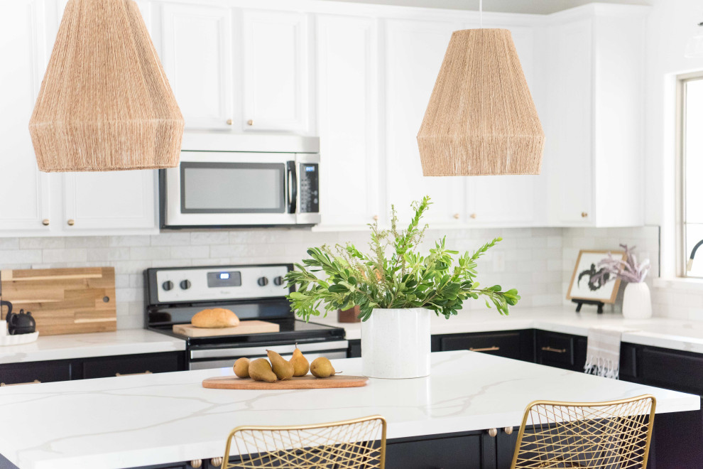 Example of a mid-sized transitional l-shaped open concept kitchen design in Phoenix with white backsplash, ceramic backsplash, stainless steel appliances and an island