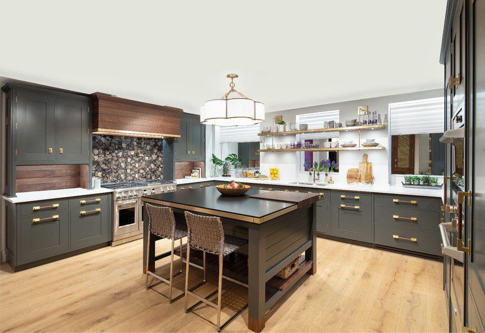 Design ideas for a transitional u-shaped kitchen in New York with an undermount sink, shaker cabinets, grey cabinets, brown splashback, timber splashback, stainless steel appliances, light hardwood floors, with island, beige floor and white benchtop.