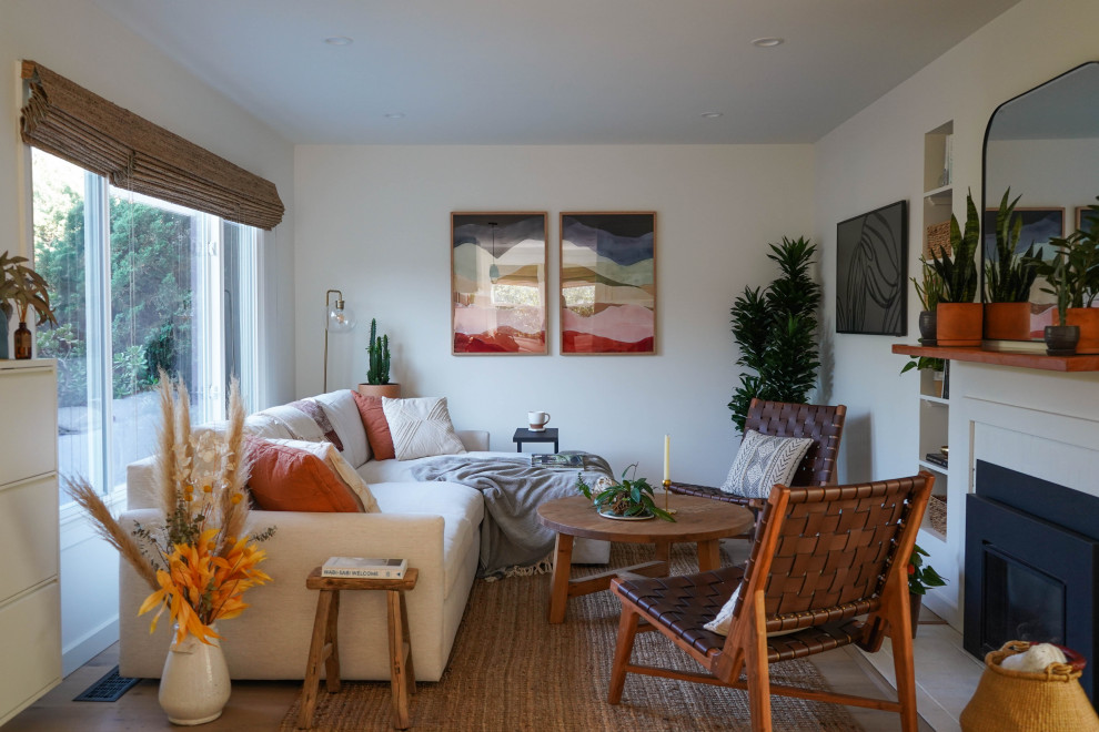 Large beach style open concept living room in San Francisco with white walls and light hardwood floors.