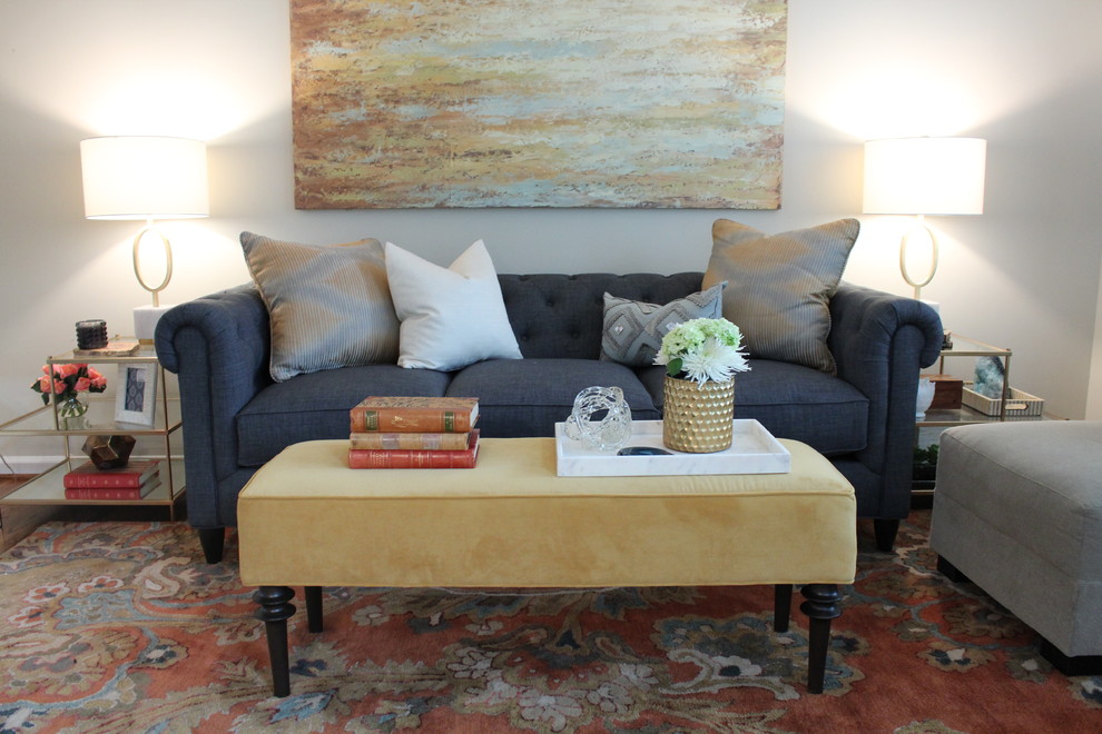 Inspiration for a small transitional formal enclosed living room in St Louis with grey walls.