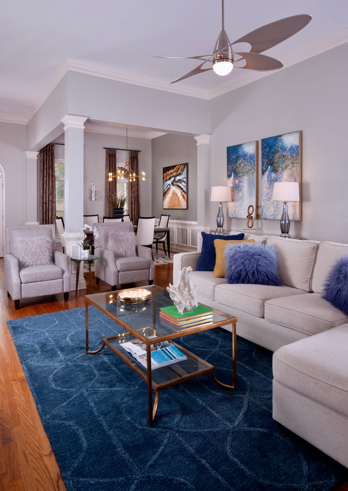 Design ideas for a transitional family room in Atlanta with medium hardwood floors and brown floor.
