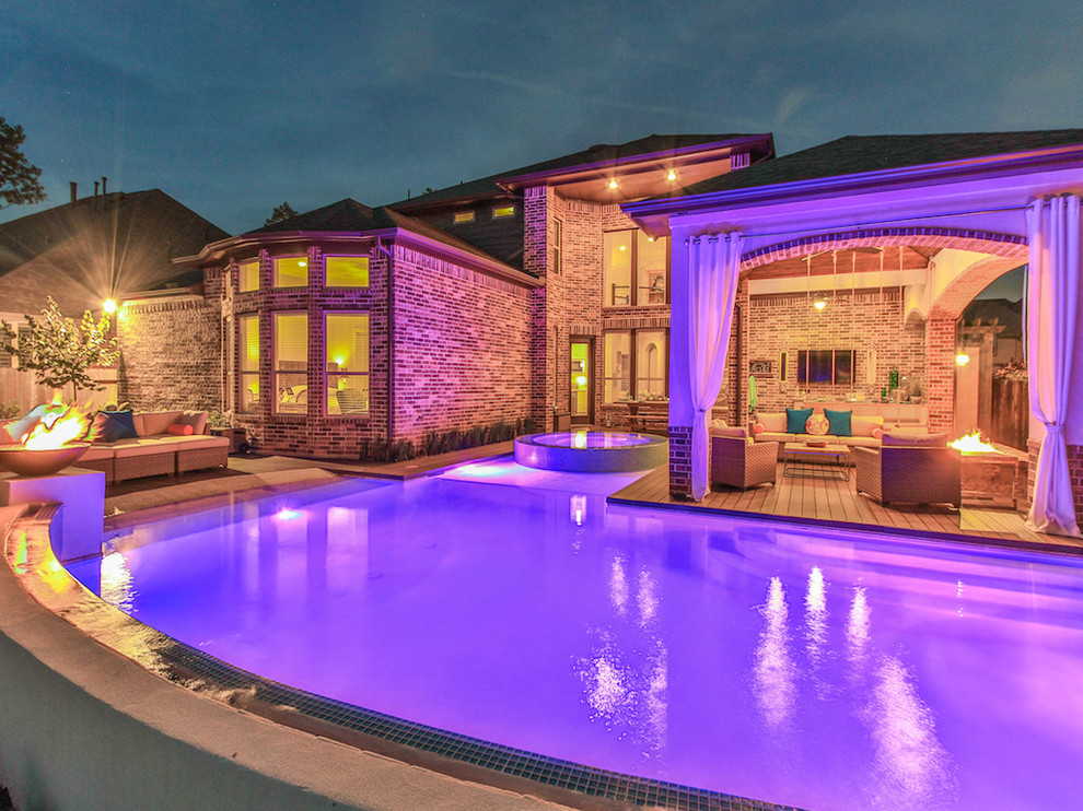 Inspiration for a large transitional backyard concrete and rectangular natural hot tub remodel in Houston