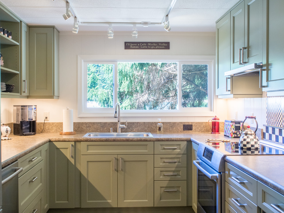 Enclosed kitchen - small transitional u-shaped vinyl floor and brown floor enclosed kitchen idea in Seattle with a drop-in sink, recessed-panel cabinets, green cabinets, laminate countertops, brown backsplash, stainless steel appliances, no island and brown countertops