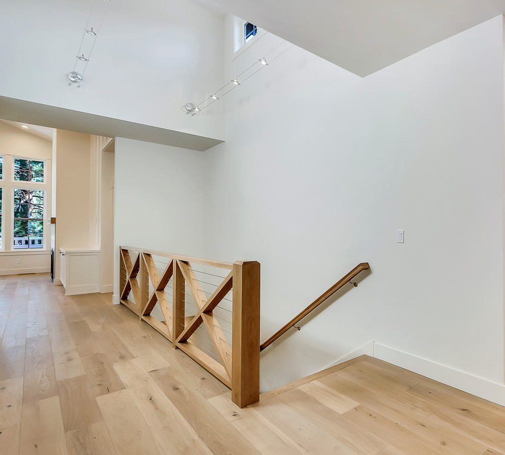 Photo of a mid-sized country entry hall in Portland with light hardwood floors.