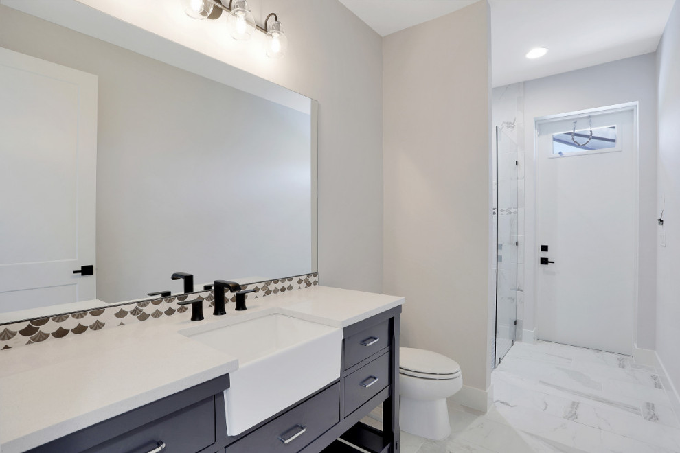 Large contemporary bathroom in Other with flat-panel cabinets, blue cabinets, a freestanding tub, an open shower, multi-coloured tile, porcelain tile, multi-coloured walls, porcelain floors, a drop-in sink, multi-coloured floor, an open shower, white benchtops, a double vanity and a built-in vanity.