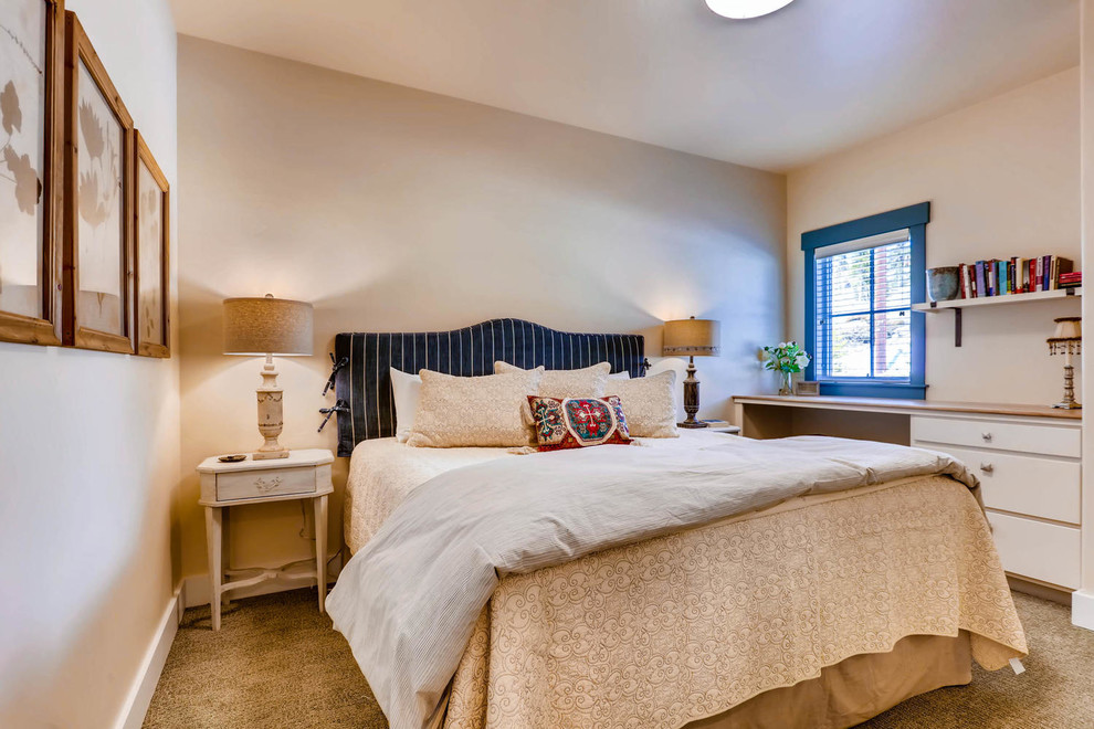 Mid-sized transitional master bedroom in Denver with beige walls, carpet and beige floor.