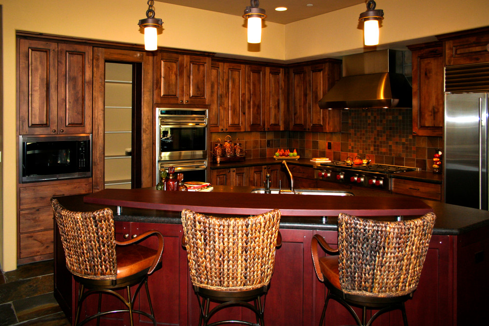 Transitional kitchen photo in Phoenix with raised-panel cabinets and an island