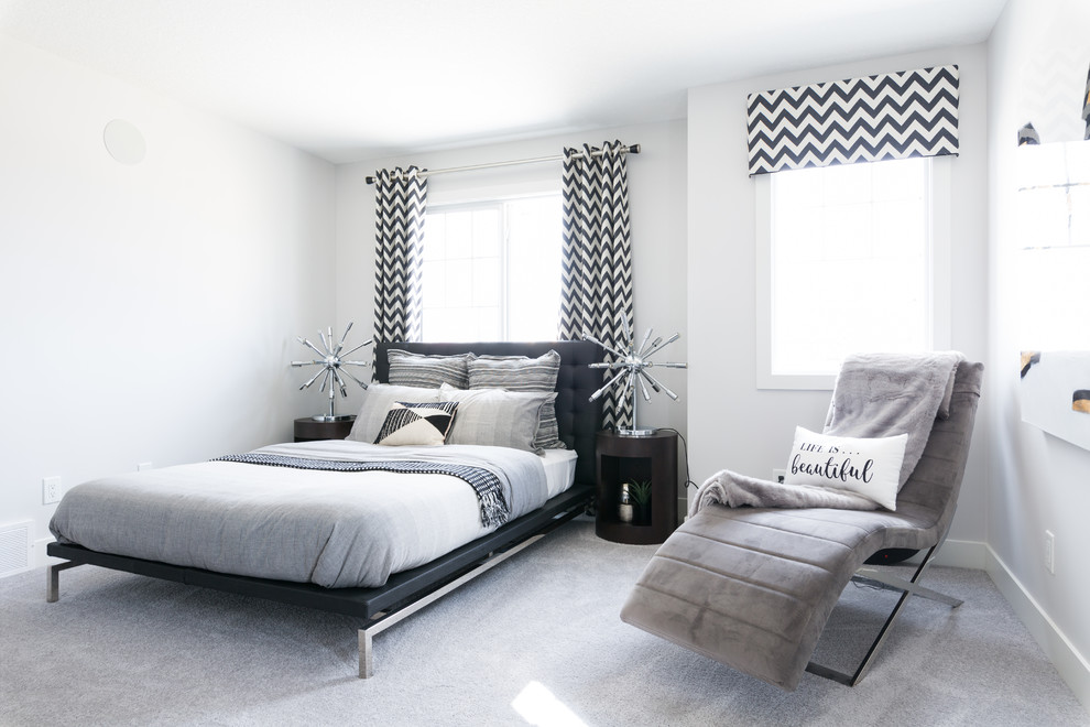 Contemporary bedroom in Edmonton with white walls, carpet and grey floor.