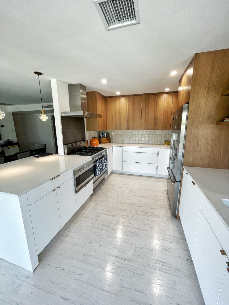 Small trendy u-shaped light wood floor and white floor enclosed kitchen photo in Phoenix with an undermount sink, flat-panel cabinets, medium tone wood cabinets, quartz countertops, gray backsplash, ceramic backsplash, stainless steel appliances, no island and white countertops