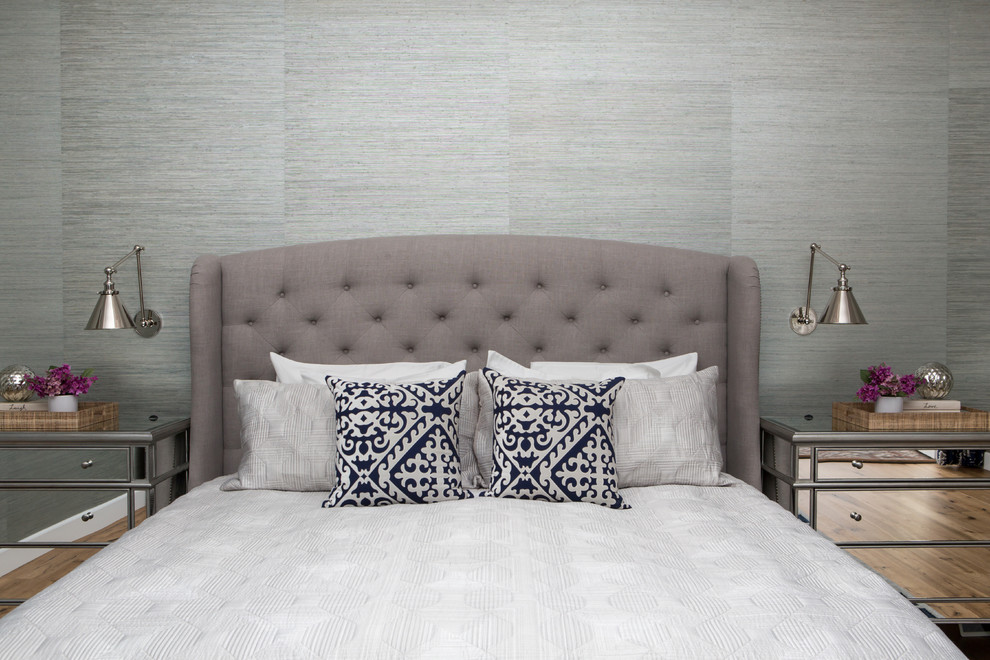 This is an example of a traditional master bedroom in Los Angeles with grey walls.
