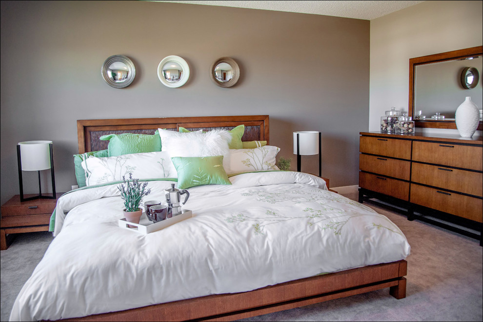 Photo of a mid-sized contemporary master bedroom in Edmonton with grey walls and carpet.