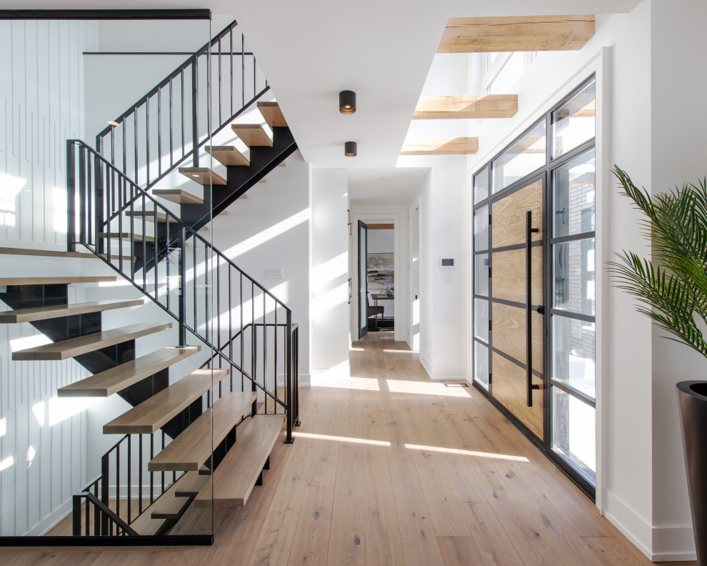 Example of a transitional home design design in Ottawa
