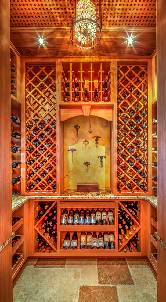 Design ideas for a mid-sized mediterranean wine cellar in Tampa with diamond bins.