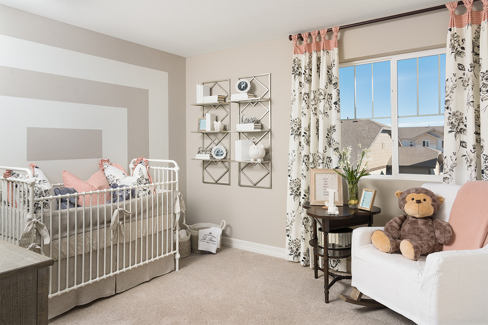 Elegant gender-neutral carpeted and beige floor nursery photo in Denver with multicolored walls