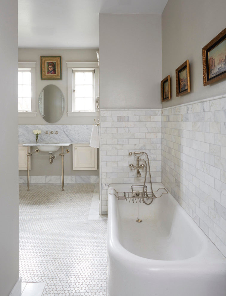 Photo of a traditional bathroom in Birmingham with recessed-panel cabinets, beige cabinets, a corner tub, grey walls, mosaic tile floors and a pedestal sink.