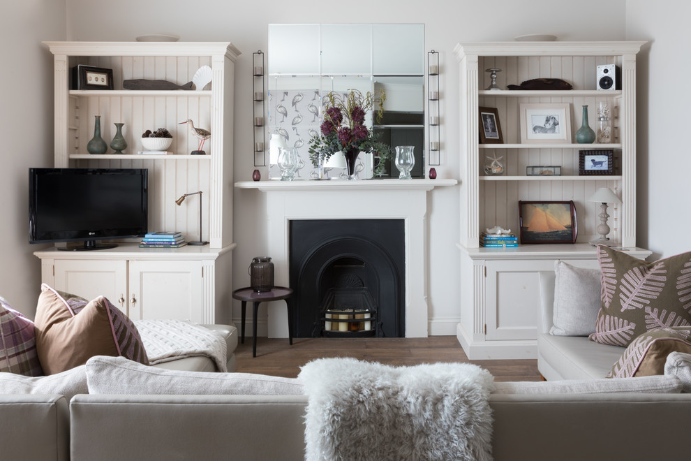 Inspiration for a beach style open concept living room in Devon with a freestanding tv.