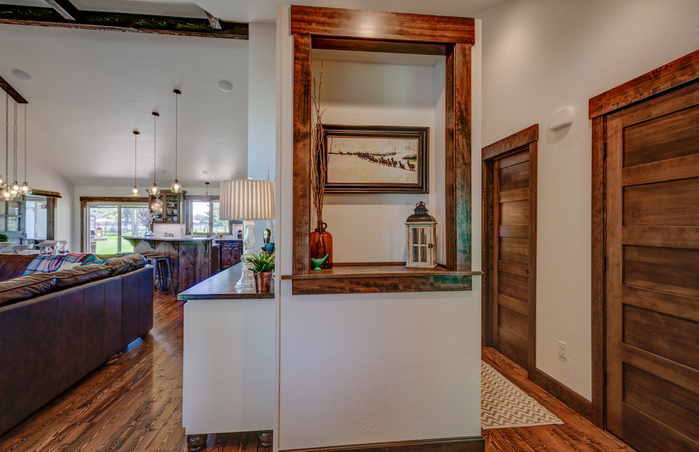 Foyer - rustic medium tone wood floor foyer idea in Seattle with white walls