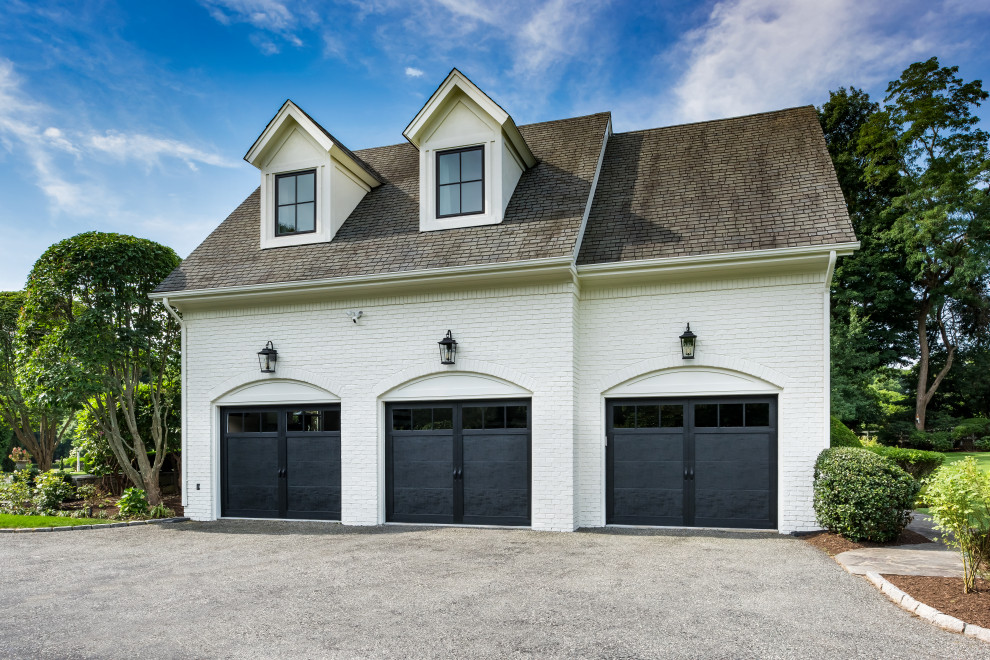 Photo of an expansive traditional attached garage in Providence with four or more cars.