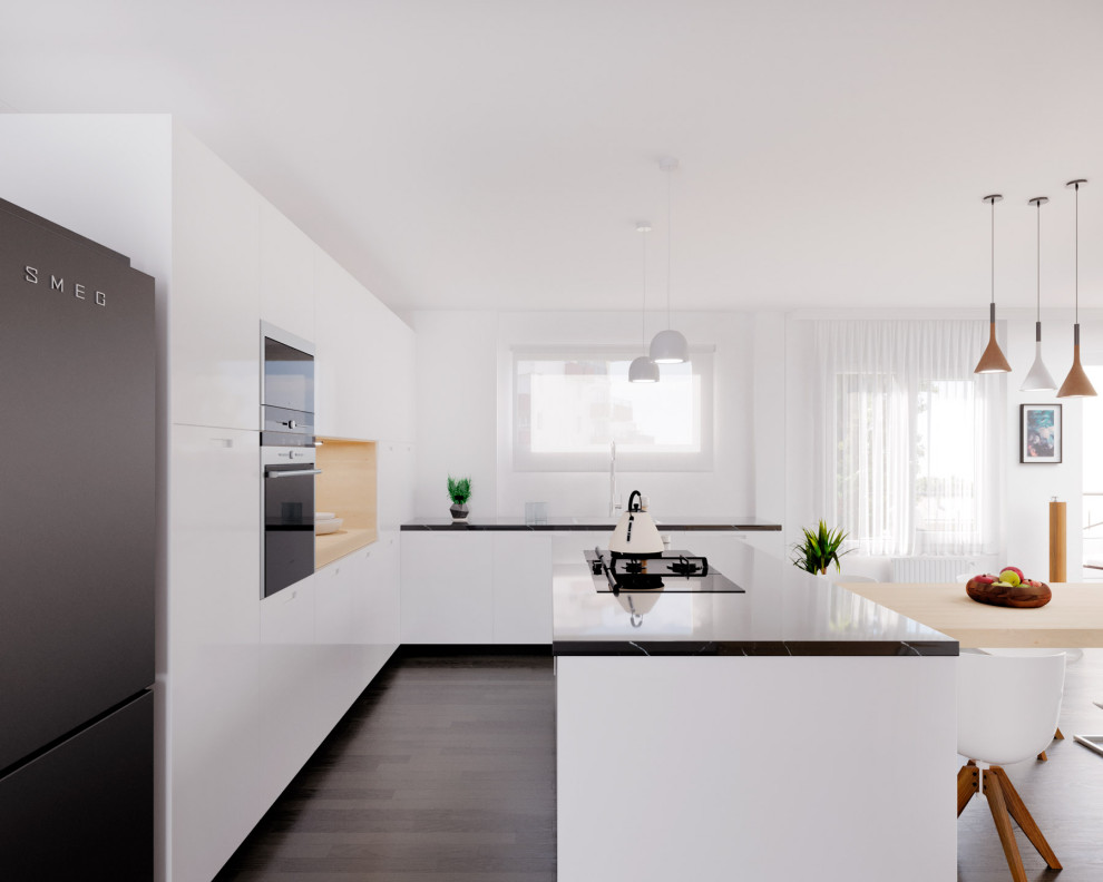 This is an example of a medium sized modern kitchen/diner in Barcelona with marble worktops, stainless steel appliances, dark hardwood flooring, an island and black worktops.