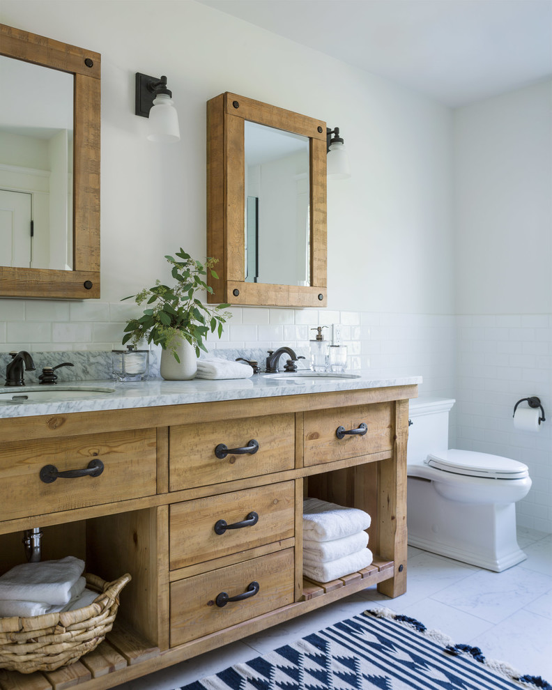 Design ideas for a mid-sized country master bathroom in Other with medium wood cabinets, a two-piece toilet, white tile, subway tile, white walls, porcelain floors, an undermount sink, solid surface benchtops, white floor, white benchtops and flat-panel cabinets.
