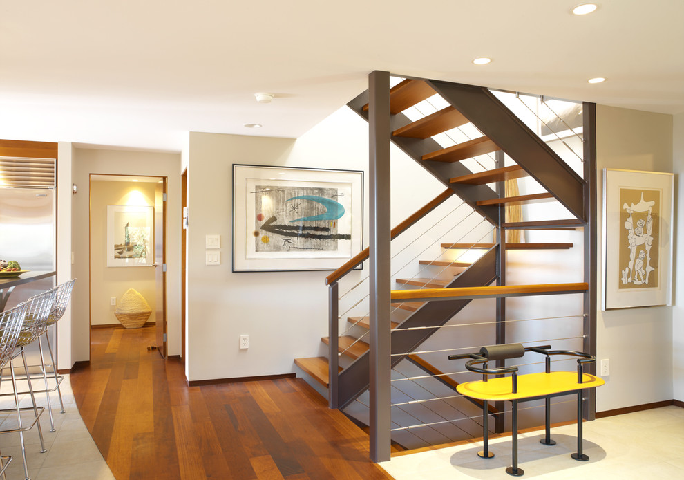 Design ideas for a contemporary staircase in Burlington with open risers and cable railing.