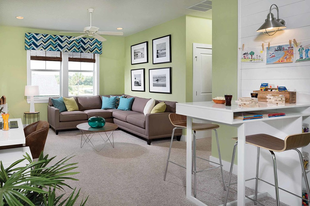 This is an example of a large contemporary gender-neutral kids' room in Miami with green walls, carpet and beige floor.