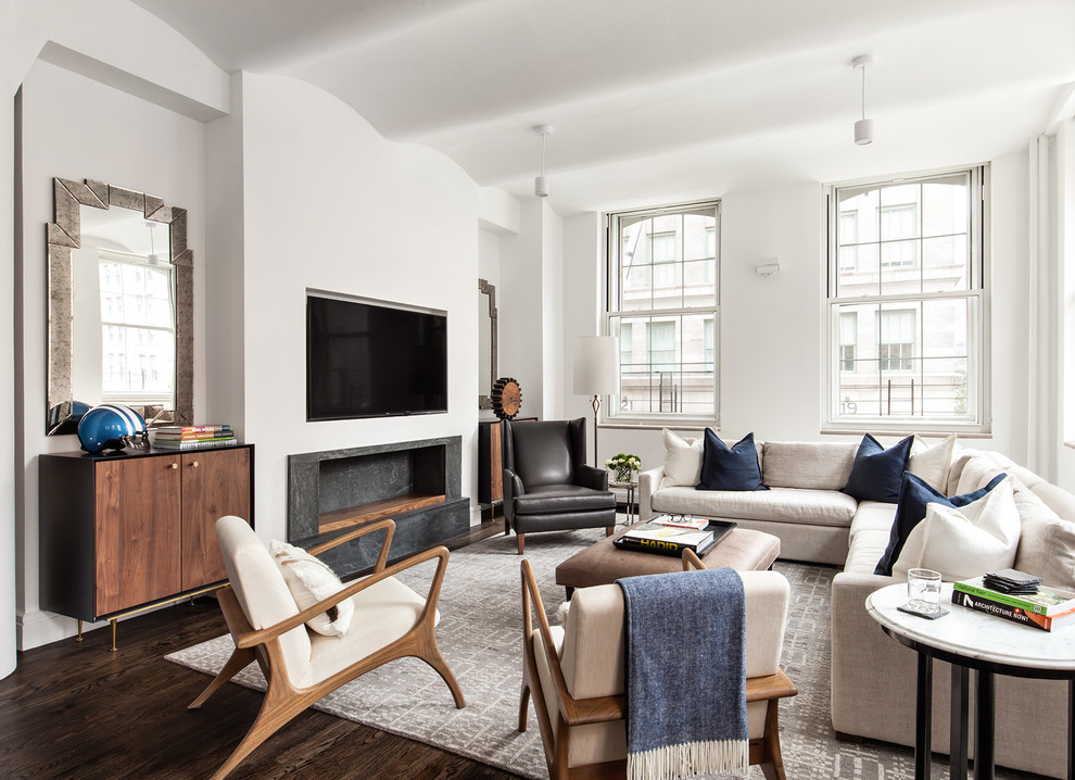 This is an example of a contemporary living room in New York with white walls, dark hardwood floors, a ribbon fireplace and a wall-mounted tv.