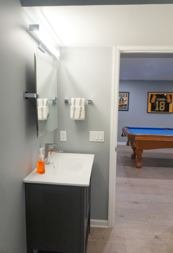 Transitional vinyl floor basement photo