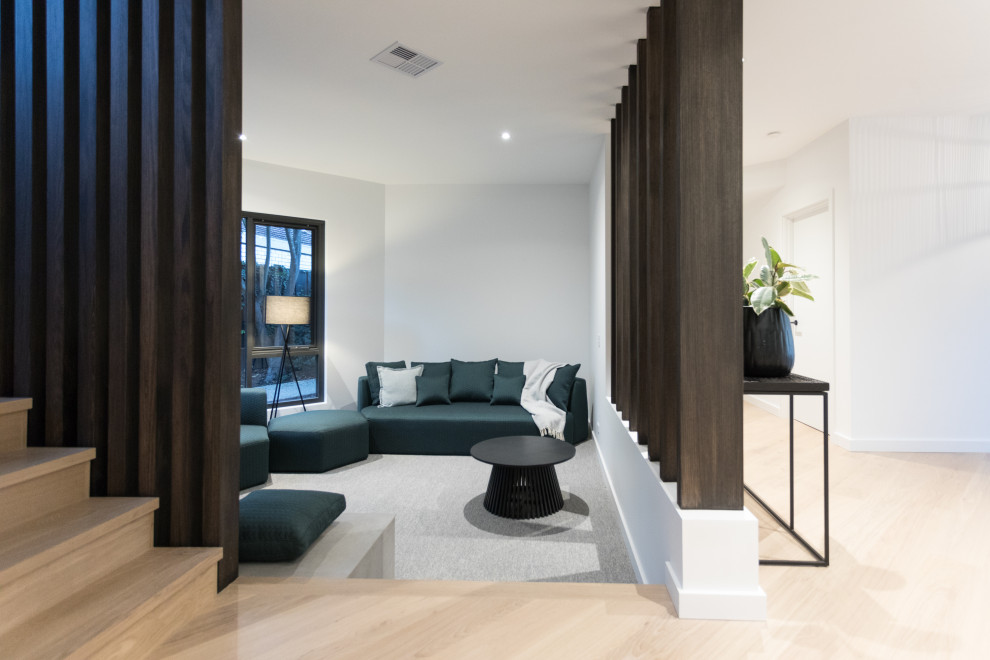Mid-sized minimalist enclosed and formal carpeted, gray floor and wood wall living room photo in Perth with white walls, no fireplace and no tv