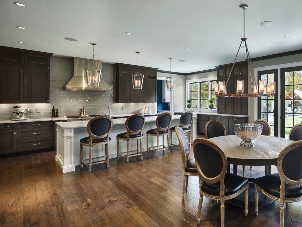 Design ideas for a transitional l-shaped open plan kitchen in Philadelphia with shaker cabinets, grey cabinets, marble benchtops, grey splashback, glass tile splashback, stainless steel appliances, medium hardwood floors and with island.