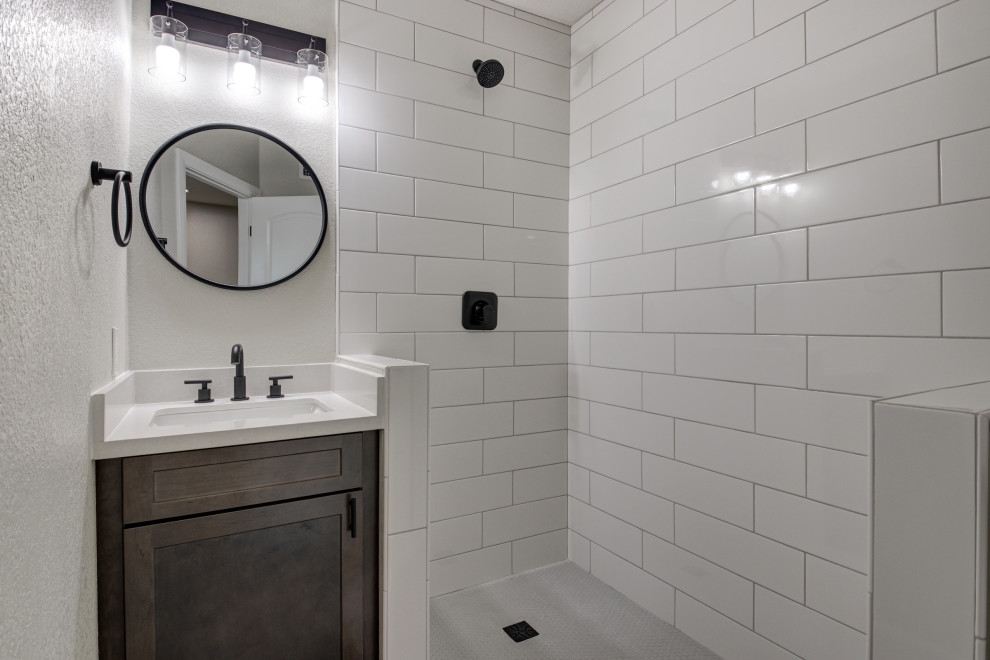 Freestanding bathtub - mid-sized transitional master white tile and subway tile double-sink freestanding bathtub idea in Phoenix with shaker cabinets, brown cabinets, an undermount sink, quartz countertops, white countertops and a built-in vanity