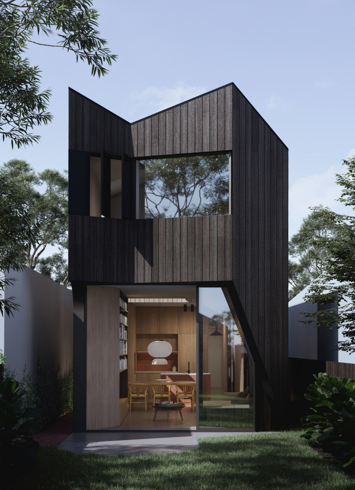 Cette image montre une façade de maison noire minimaliste en bois à un étage avec un toit noir et un toit en métal.
