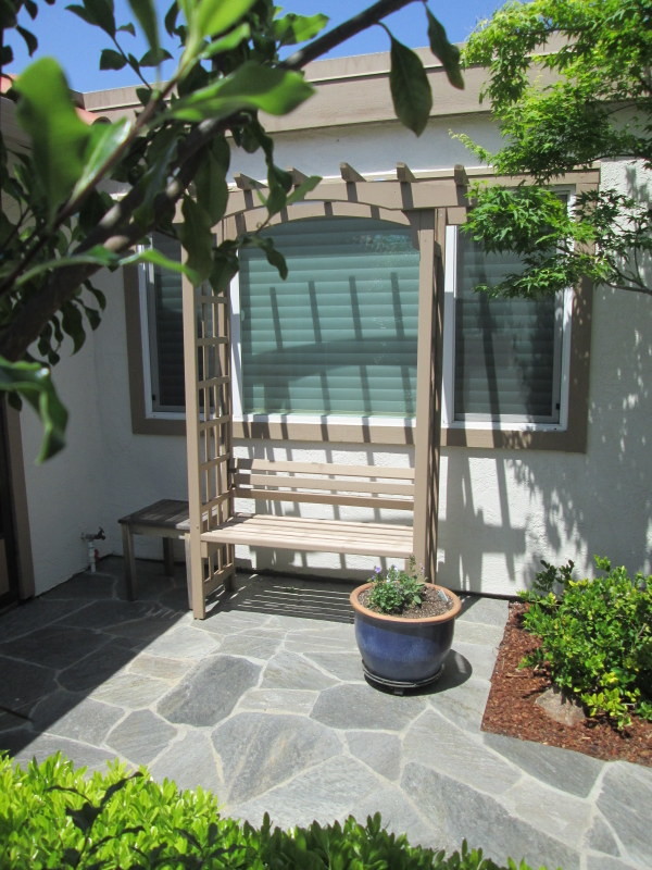 This is an example of a small asian front yard partial sun garden for fall in San Francisco with natural stone pavers.