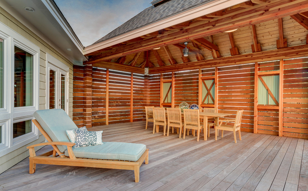 Inspiration for a contemporary backyard deck remodel in Other with a roof extension