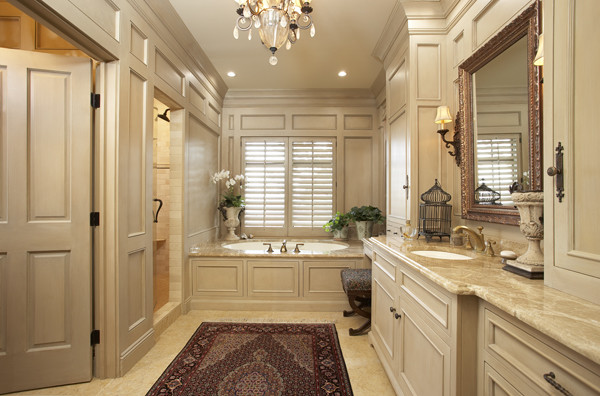 Design ideas for a large traditional master bathroom in Minneapolis with recessed-panel cabinets, beige cabinets, an undermount tub, an alcove shower, beige walls, an undermount sink and granite benchtops.