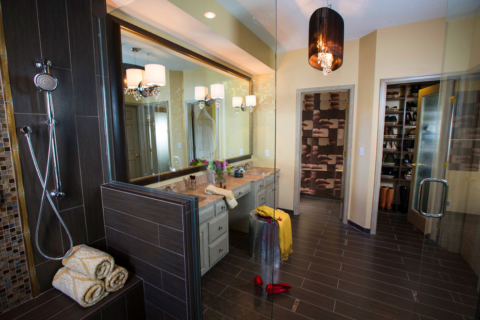 This is an example of a contemporary bathroom in Minneapolis with an integrated sink, raised-panel cabinets, beige cabinets, a corner shower and brown tile.