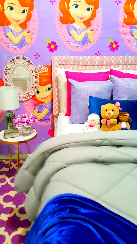This is an example of a small classic kids' bedroom for girls in Los Angeles with carpet, purple floors and wallpapered walls.