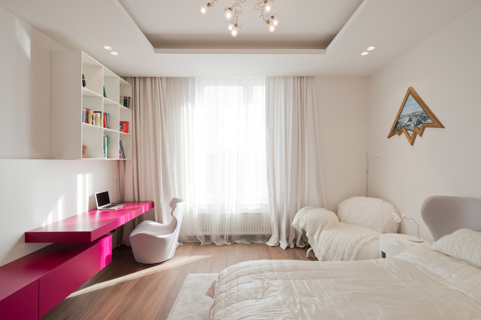 Design ideas for a mid-sized contemporary kids' room for girls in Moscow with white walls.