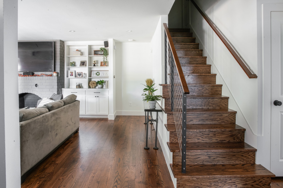Design ideas for an expansive midcentury wood straight staircase in Dallas with wood risers and metal railing.