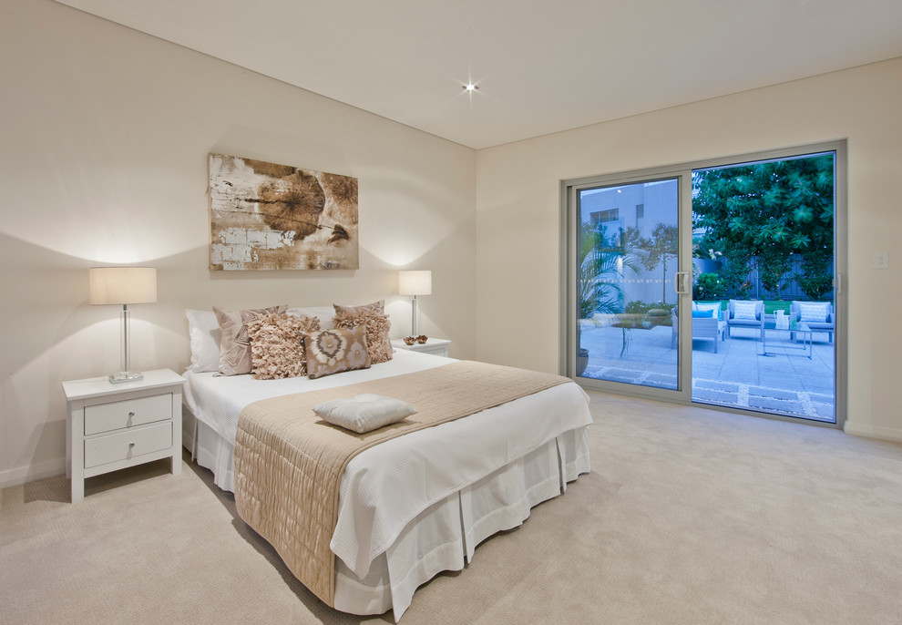 Large modern master bedroom in Perth with beige walls, carpet and no fireplace.