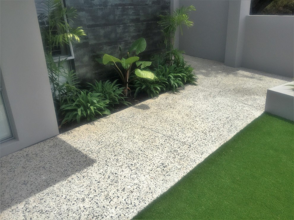 Inspiration for a large modern front yard full sun driveway in Perth with a garden path.