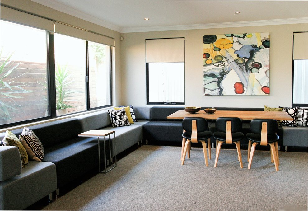 Photo of a large midcentury open concept living room in Perth with white walls and carpet.
