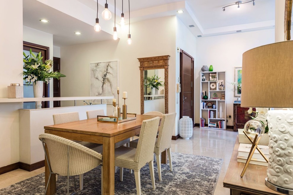 Inspiration for a transitional open plan dining in Singapore with white walls and beige floor.