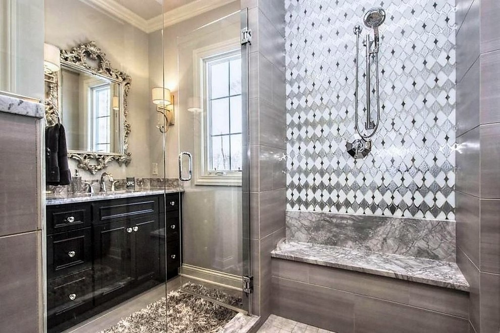 Example of a mid-sized transitional master gray tile and porcelain tile porcelain tile and gray floor doorless shower design in Columbus with raised-panel cabinets, black cabinets, gray walls, granite countertops, an undermount sink and a hinged shower door